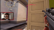a man wearing headphones and glasses is playing a video game with anarchy written on the screen