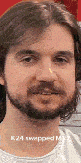 a close up of a man 's face with the words k24 swapped mr.