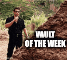 a man is standing next to a pile of dirt with the words vault of the week written on it .