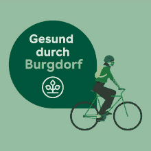 a person is riding a bike with the words gesund durch burgdorf behind them