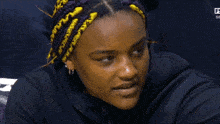 a close up of a woman 's face with the letter f on the bottom right