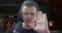 a man wearing headphones giving an ok sign