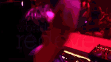 a blurred image of a dj in front of a crowd that says ' i love you '