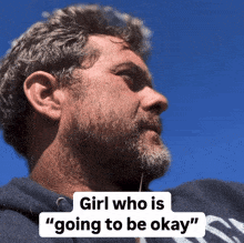 a man with a beard and the words girl who is going to be okay below him