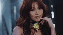 a close up of a woman wearing a choker with rhinestones on it
