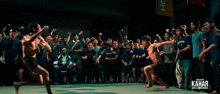 a poster for kahar martial arts school shows two men wrestling