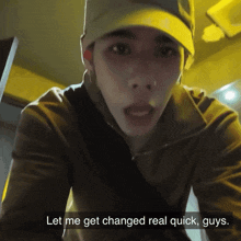 a man wearing a hat and a jacket says " let me get changed real quick guys "