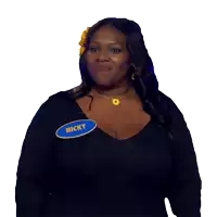 a woman wearing a name tag that says nicky on it