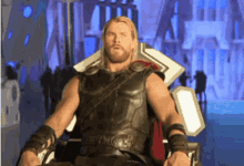 thor is sitting on a throne and looking at the camera