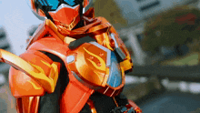 a close up of a person wearing a helmet with a flame on it