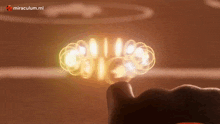 a close up of a person 's hand touching a glowing object