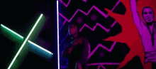 a man is standing in a dark room with neon lights .