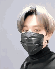 a close up of a person wearing a mask
