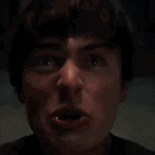 a close up of a man with his mouth open