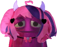 a pink and purple stuffed animal with horns and a bow