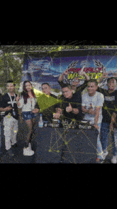 a group of people standing in front of a sign that says mobile