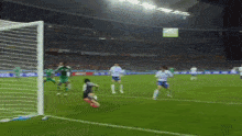 a soccer game is being played in a stadium with a sign that says ' coca cola ' on it