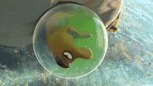 a cartoon character is in a green bubble