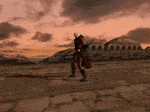 a man in a red coat holding a sword in a video game