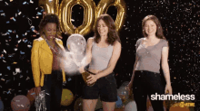 three women are celebrating with balloons and confetti and the word shameless is on the bottom right