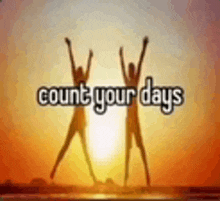 a picture of two people jumping in the air with the words `` count your days '' in the background .