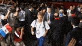 a man in a white shirt with the word police on the back