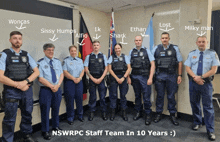 a group of police officers standing next to each other with the words nswrpc staff team in 10 years written below them