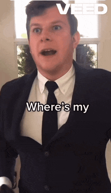 a man in a suit and tie is asking where 's my