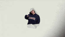 a girl wearing a sweatshirt that says karmine