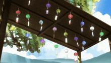 a bunch of wind chimes hanging from the ceiling