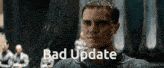 a close up of a man 's face with the words bad update written below him