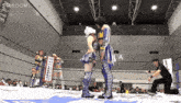 a woman in a wrestling ring with a sign that says stardom on it