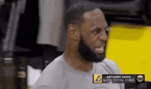 a man with a beard is wearing a t-shirt that says anthony davis on the front .