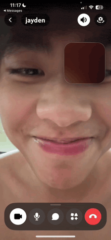 a phone screen shows a video call with jayden on it