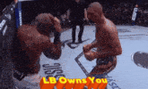 two men in a boxing ring with the words lb owns you
