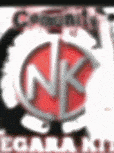 a blurry picture of a nk logo with the words community ecara kin on the bottom