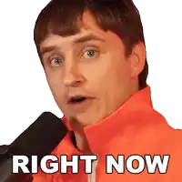 a man in an orange jacket is speaking into a microphone with the words right now written below his face