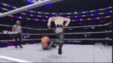 a video of a wrestler running in a ring with the words viggle ai on the bottom right