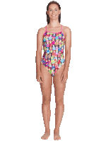 a woman wearing a swimsuit with a pattern of bottles on it
