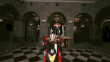 a person in a red and white costume with yellow eyes