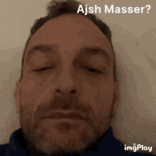 a close up of a man 's face with ajsh masser written in the corner