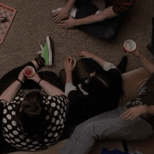 a group of people laying on the floor playing a game