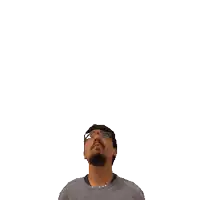 a man with a beard and glasses is looking up at the number 16