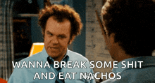 a man looking at himself in a mirror with the words wanna break some shit and eat nachos