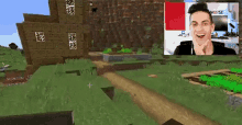 a man is playing a video game in front of a screen with a picture of him .