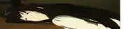 a woman with long black hair is laying on the floor with her eyes closed