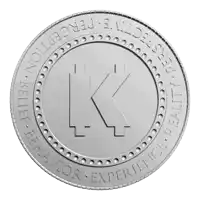 a silver coin with the letter k in the middle