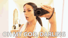 a woman is taking a picture of herself with the words oh my god darling below her