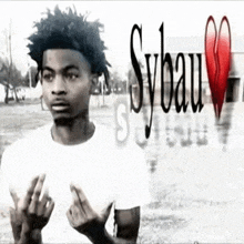 a black and white photo of a young man with sybau written in red