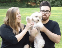 Fit Couple Cooks Puppy GIF